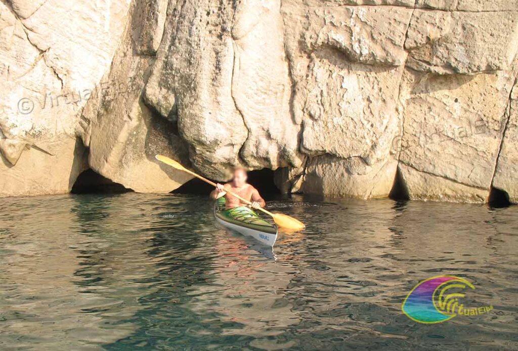 Kayaking in front of the entrance of the Cave of the Sbruffo