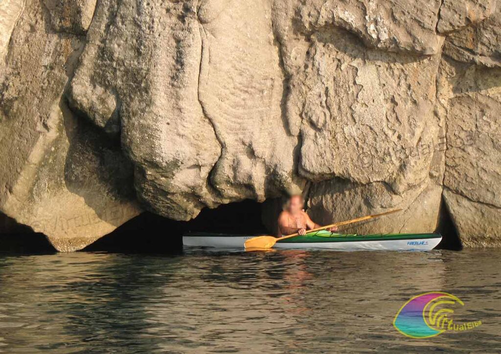 Kayaking in front of the entrance of the Cave of the Sbruffo